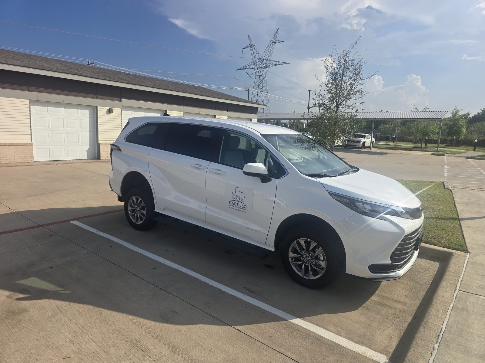 Front angle of a white Castillo Medical Transportation Toyota Sienna vehicle